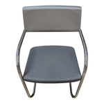 a grey chair with metal legs
