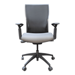 a grey office chair with wheels