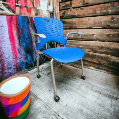 used Herman Miller Blue Caper Stack Chair with casters